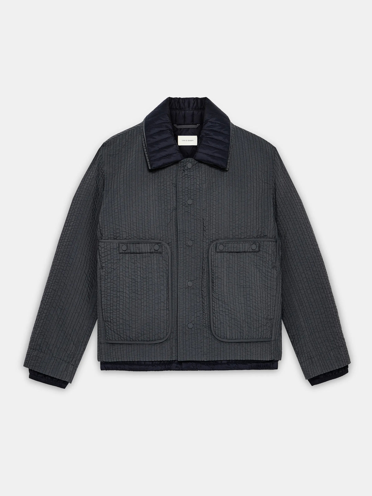 Grey/black midweight double layered quilted worker jacket by Craig Green flat front view
